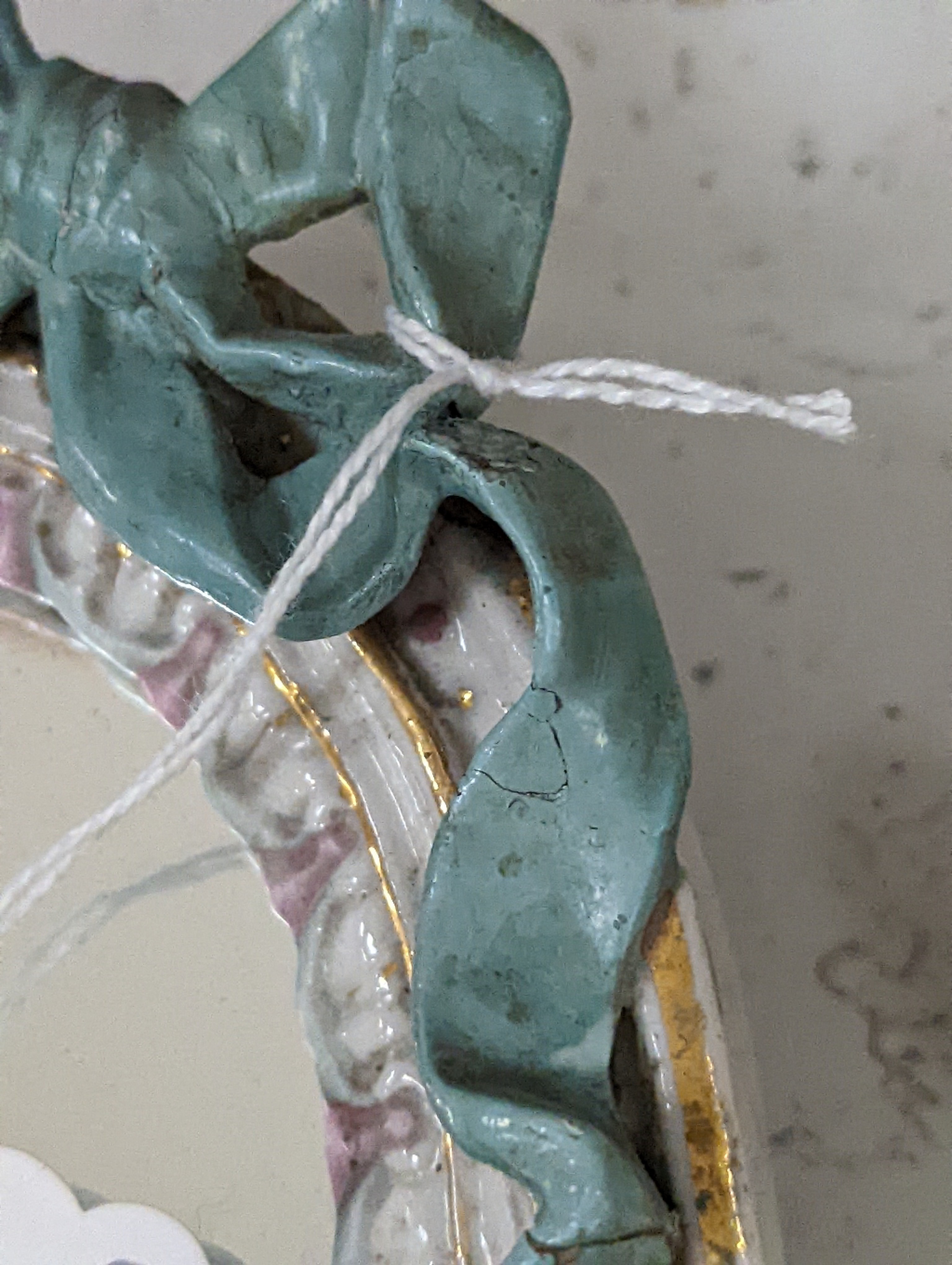 Two German porcelain easel mirrors and a Belleek easel mirror, tallest 43cm